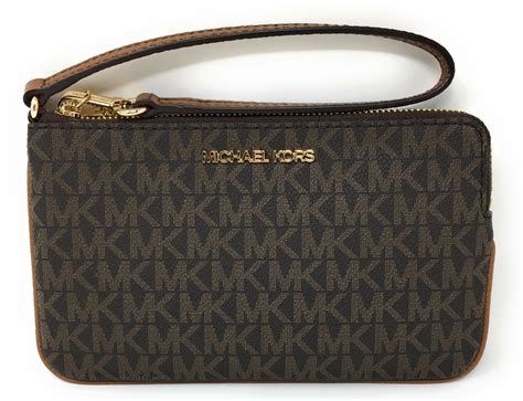 michael kors jet set charm large top zip wristlet|Michael Kors double zipper wallet.